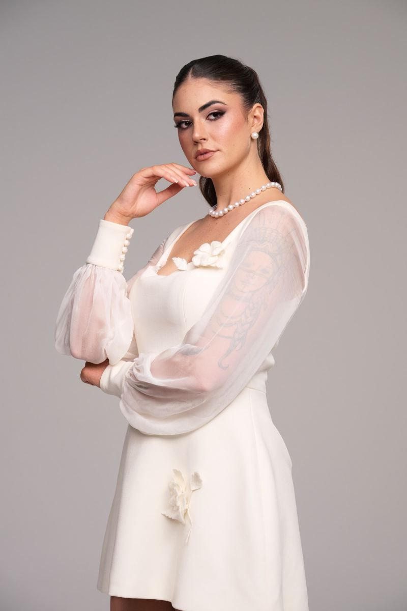 Stevie Hearl wearing the Chanel dress in ivory merino wool for Horrocks Vale Collections
