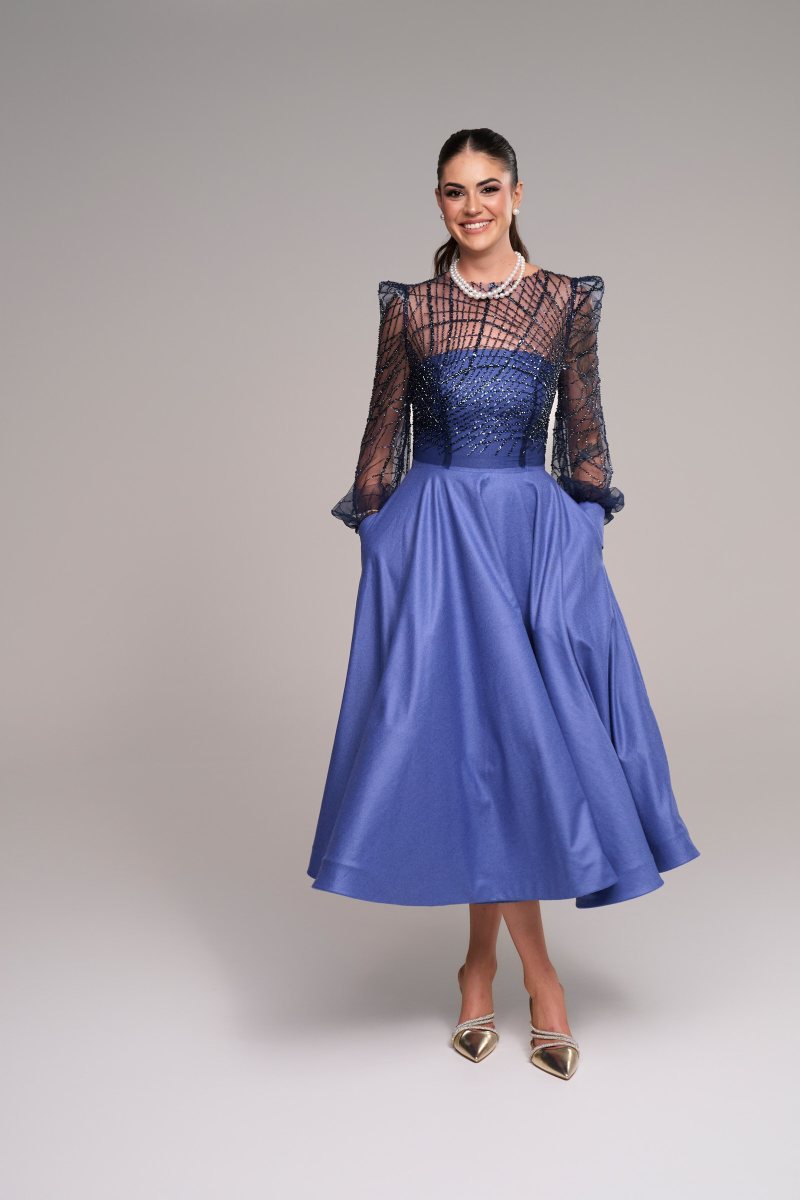 Stevie Hearl in the blue Eva dress with a sheer lace overlay bodice