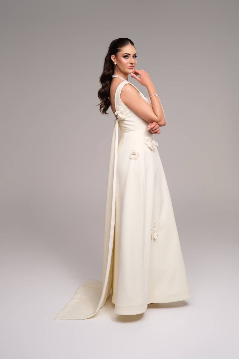 Stevie Hearl in the Grace gown with floral appliqués and full merino wool train