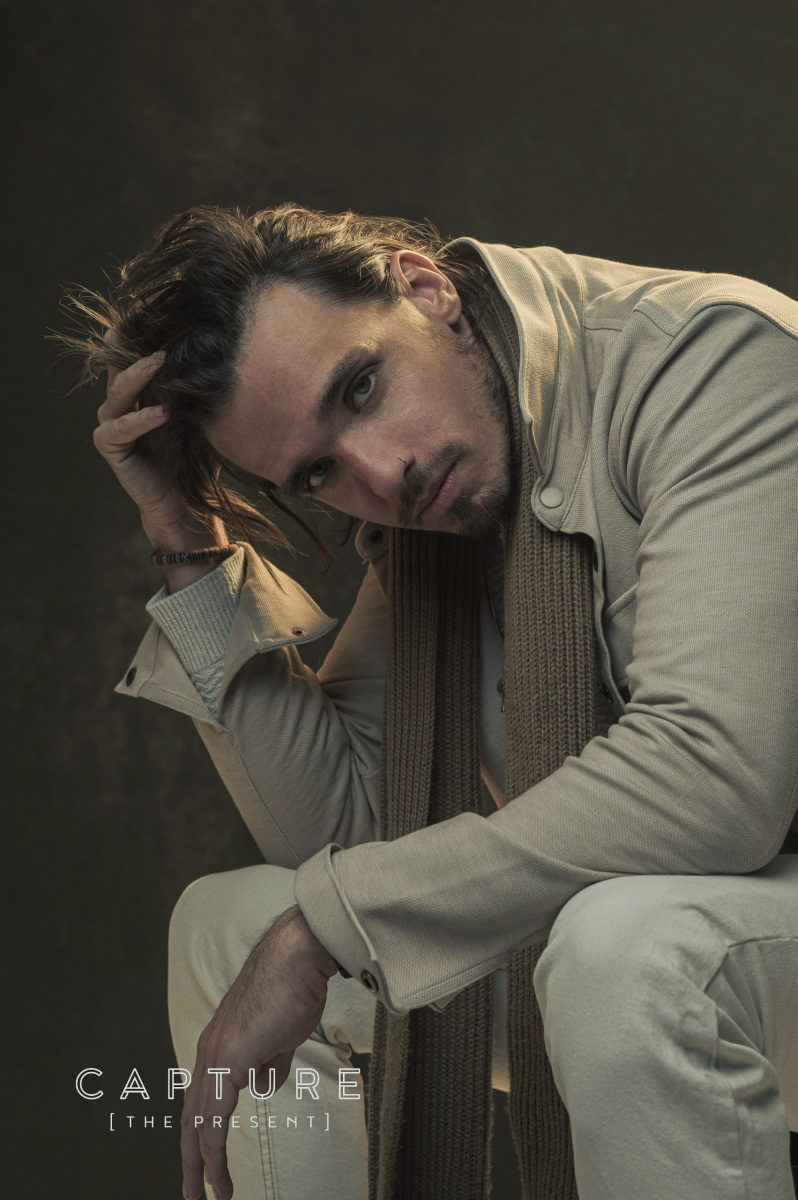 Singer Mason Lloyd in a moody seated portrait at Cog Creative Space in Norwood