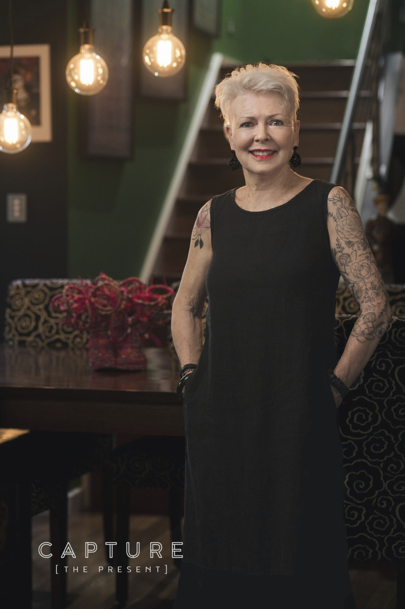 Full length portrait of Campbelltown artist Judy Parker in her house