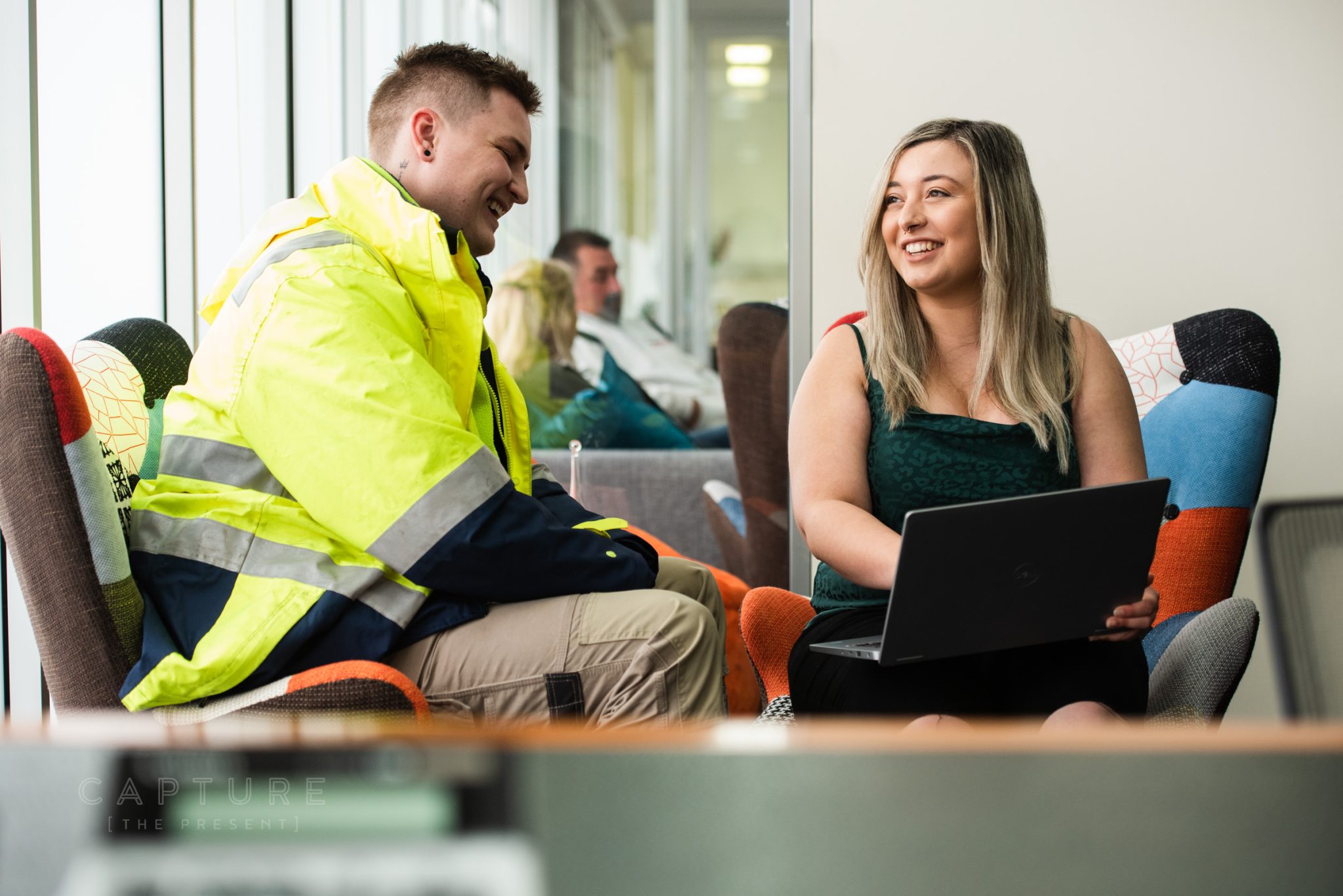 Accountant Nicole talking with a tradesman client at DMC Tax in Mawson Lakes