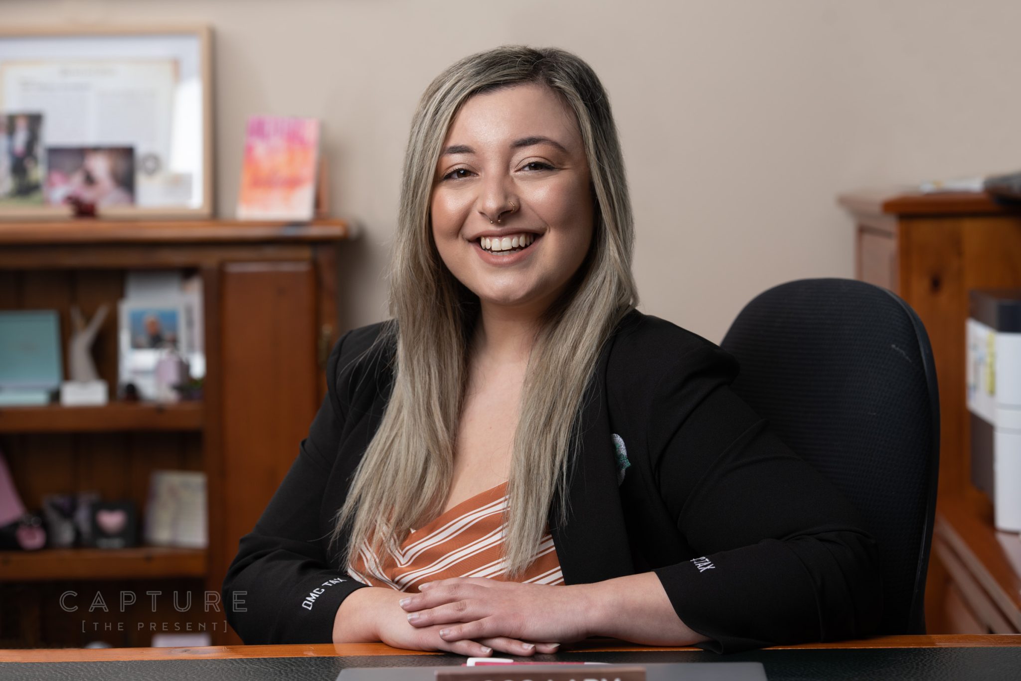 Portrait of DMC Tax accountant Nicole at her desk in the Mawson Lakes office